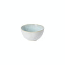 Simple, elegant ceramic bowl with speckled exterior and serene interior.