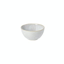 Handcrafted ceramic bowl with speckled finish, perfect for serving food.