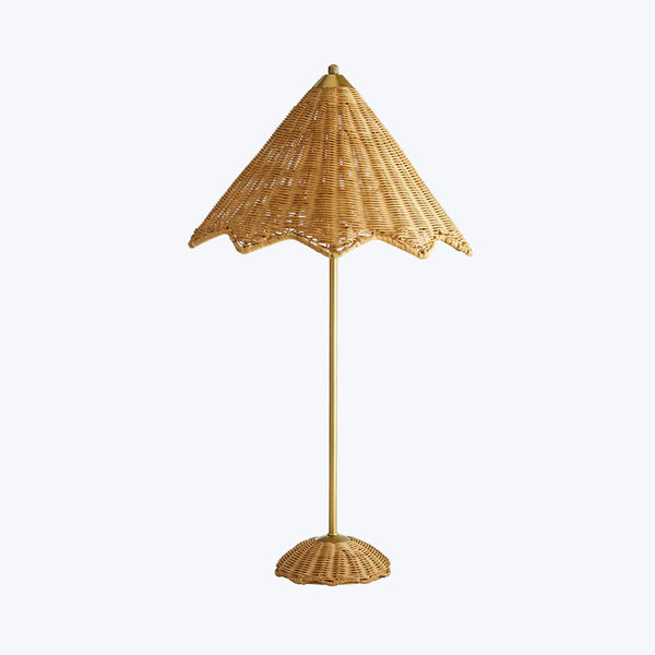 Tropical-inspired floor lamp with woven canopy creates cozy ambiance.