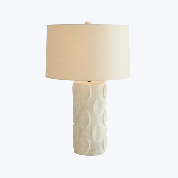 Contemporary table lamp with elegant white base and neutral shade.