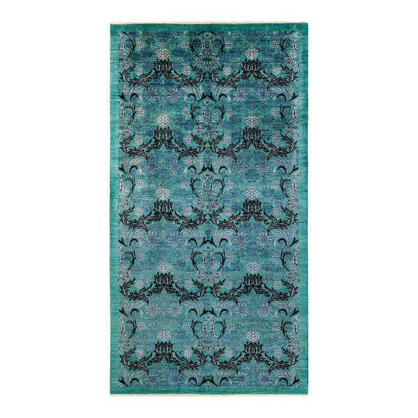 Intricate symmetrical floral patterned area rug with teal background.