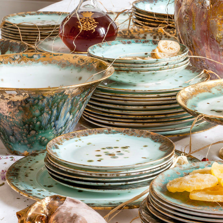 Vintage ornate tableware in green, white, and gold colors displayed.