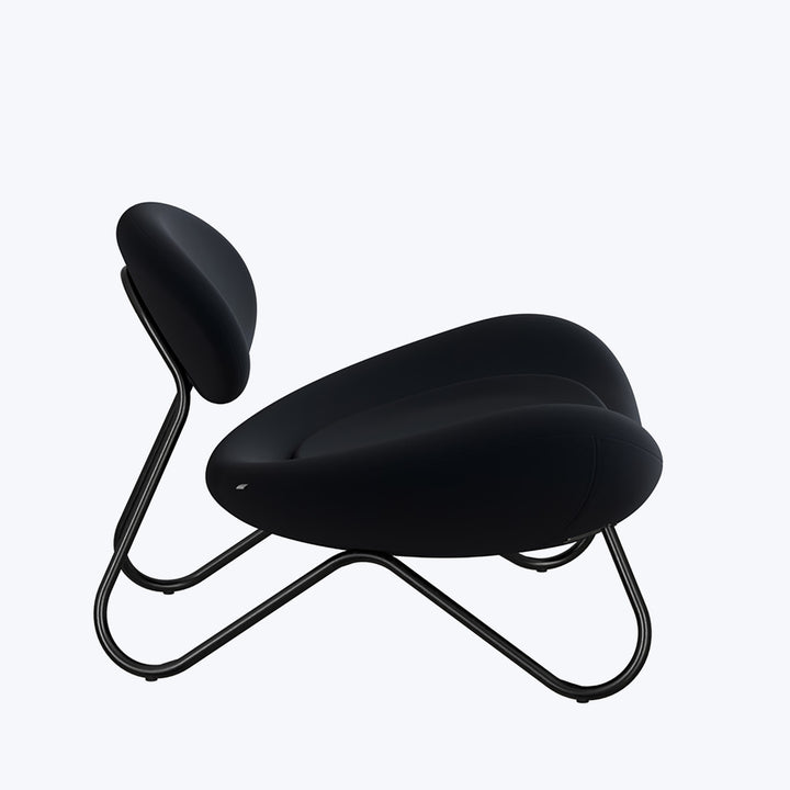 Modern lounge chair with sleek design, black color scheme, comfortable padding
