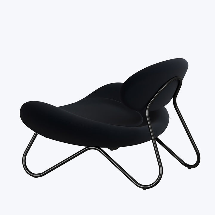 Modern chair with fluid, organic design and black upholstery material.