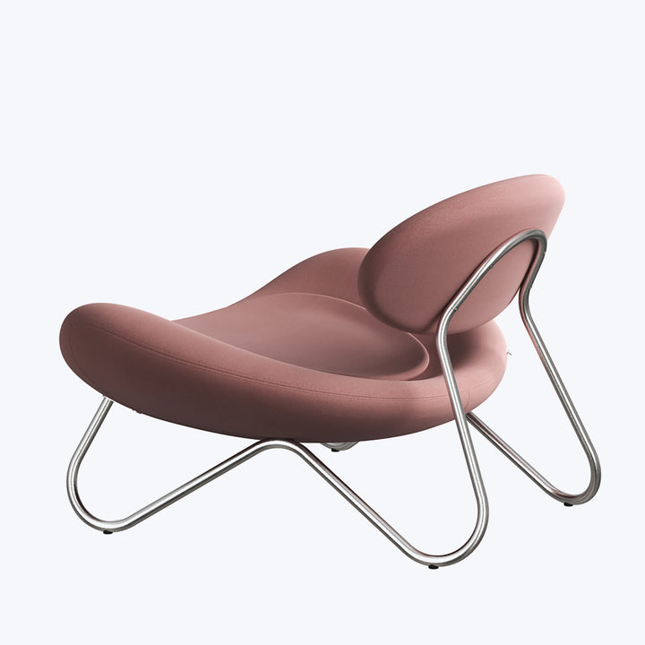Modern lounge chair with organic shape and mauve upholstery design.