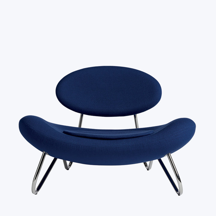 Modern chair with sleek design, dark blue upholstery, and metallic legs