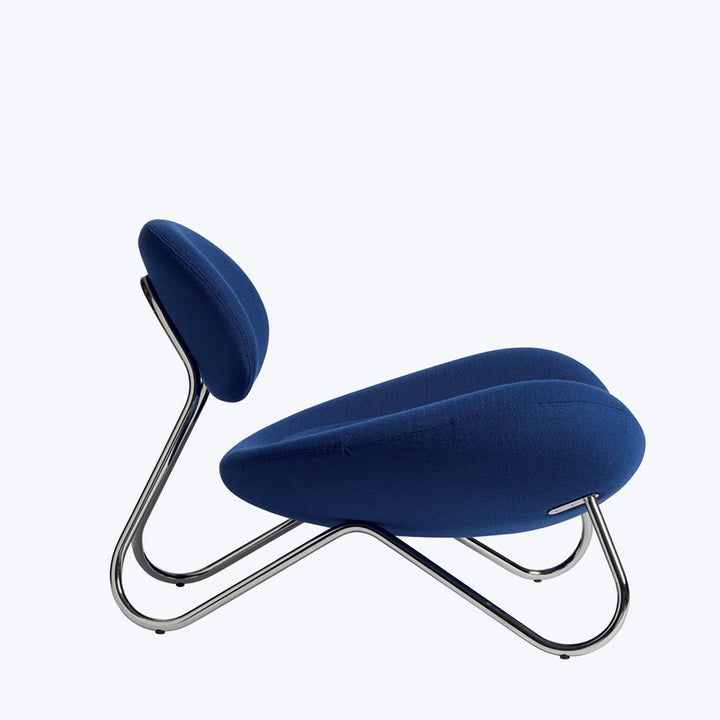 Modern lounge chair with blue upholstery and chrome frame design.