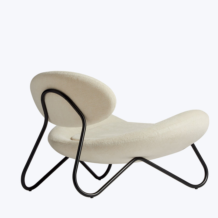 Sleek, modern lounge chair with unique design and comfortable upholstery.