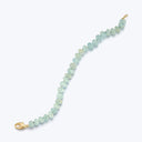 Graduated pale green bead bracelet with gold clasp, elegant design