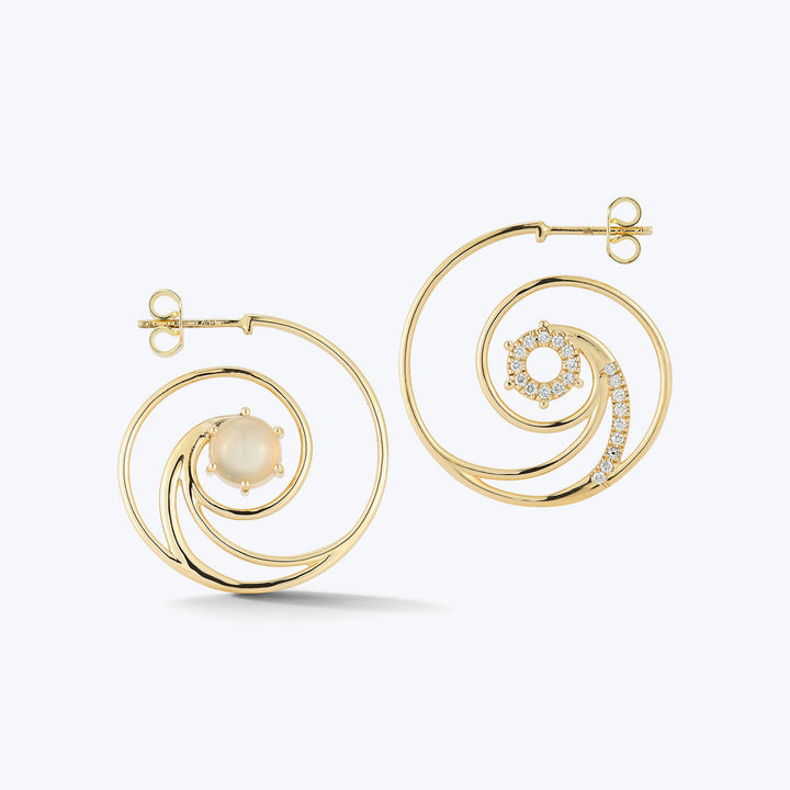 Elegant gold earrings with pearls and gemstones, modern design statement.