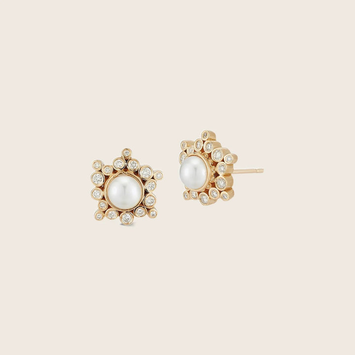 Elegant pearl and gemstone earrings in gold-tone flower design.