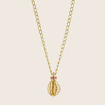 Gold necklace with sea shell pendant and pink gemstones